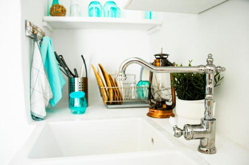 a kitchen sink with a faucet in a kitchen at Turquesa Beach&Pool Apartaments in Playa Honda