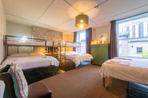 a bedroom with two bunk beds and a window at Georgian Loft Apartment in Dublin