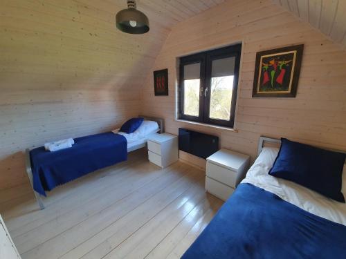 Katil atau katil-katil dalam bilik di Apartamenty Wiślany Przekop