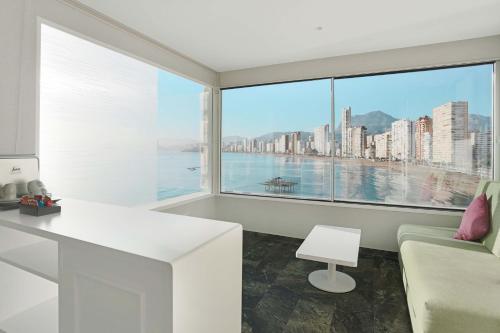 a living room with a view of a city at KAKTUS Hotel Benikaktus in Benidorm