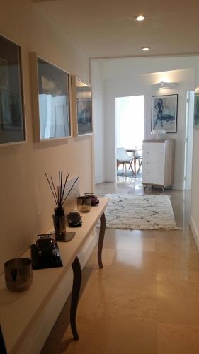 a living room with a table with plants on it at Appartement Centre ville carré d'Or in Monte Carlo