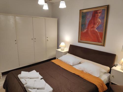 מיטה או מיטות בחדר ב-Casa DIVA apartment
