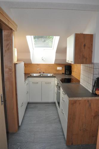 a kitchen with a sink and a skylight at Ferienwohnung Haus König in Türnitz