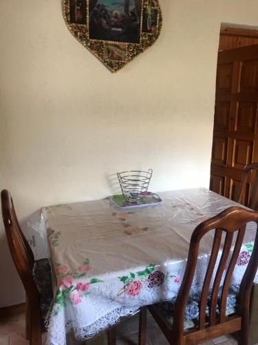 a table with a table cloth on top of it at Apartman Nadia in Karlobag