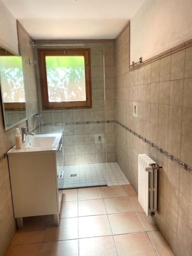 a bathroom with a sink and a mirror at Villa Begur - Sa Fontansa in Begur