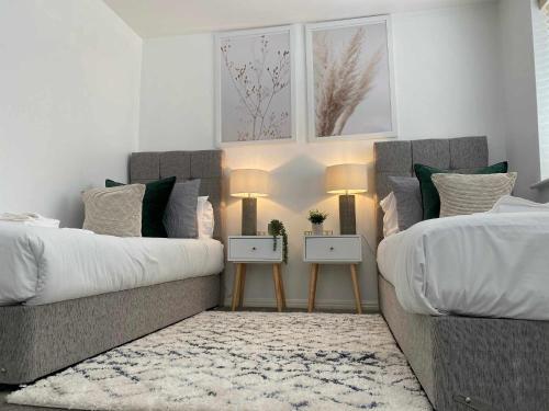 Ένα ή περισσότερα κρεβάτια σε δωμάτιο στο Sutton Heath Lodge