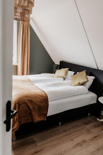 Ένα ή περισσότερα κρεβάτια σε δωμάτιο στο Vakantiehuis 6 personen in de Achterhoek met sauna