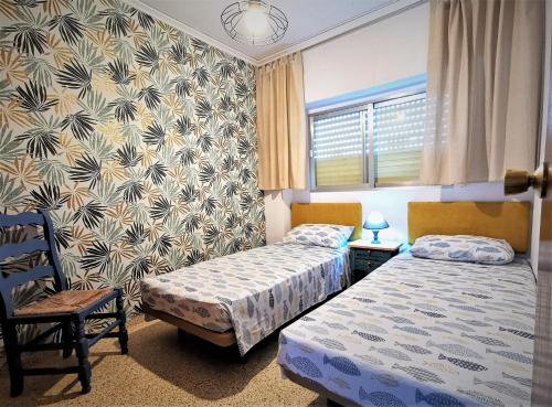 Cama o camas de una habitación en Apartamento Sol & Playa Gandia solo Familias