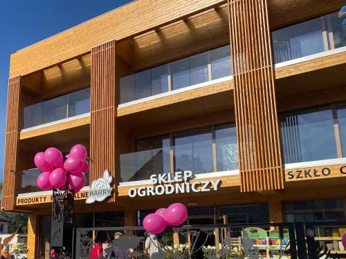 a building with pink balloons in front of it at Apartamenty u Harrego BOUTIQUE SPA z klimatyzacja, balkon, sauna, tężnia parking in Kudowa-Zdrój