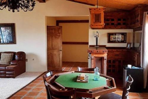 a living room with a table and a fireplace at Large apartament near the beach in Rosarito