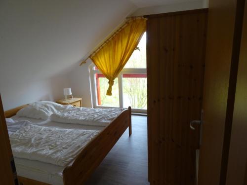 Cama o camas de una habitación en Ferienhaus Ostseeblick