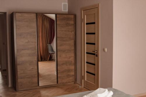 a mirror in the corner of a room at Espresso in Myrhorod