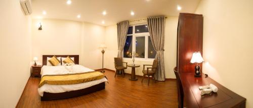 เตียงในห้องที่ Green Garden Residence Hotel