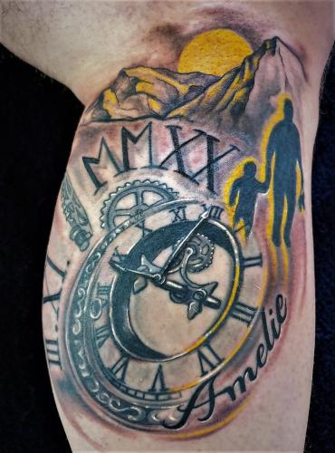 a man with a clock tattoo on his arm at Tattoo PENSION mit Restaurant und Tattoo-Studio in Mörtschach