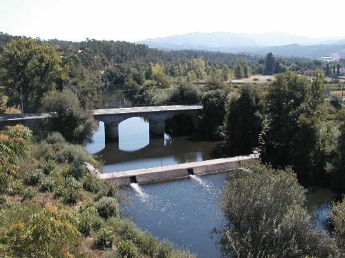 an aerial view of a bridge over a river at Casa Rustica in Arganil