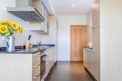 A kitchen or kitchenette at Sublime Vilamoura Aquamar 106 by JG Apartments
