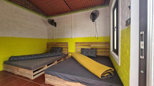 Giường trong phòng chung tại Datani Mộc Châu Homestay