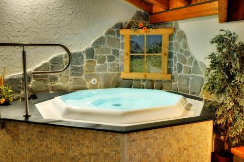 a large bath tub sitting on top of a counter at Albergo Miramonti in Rabbi