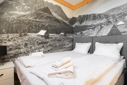 Katil atau katil-katil dalam bilik di Apartamenty Rezydencja Karpielówka