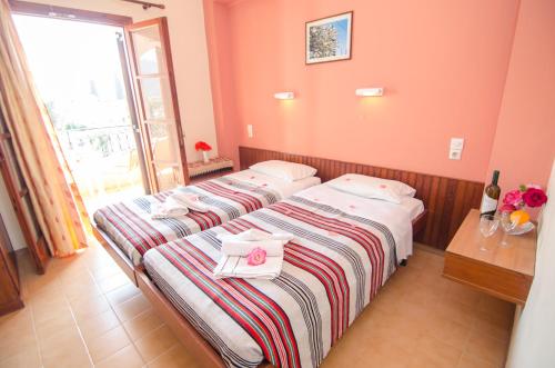 Postel nebo postele na pokoji v ubytování Margarita Aparthotel