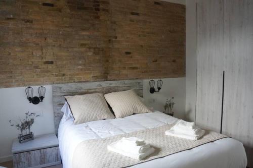 Postel nebo postele na pokoji v ubytování Barcelona Industrial Style Apartment