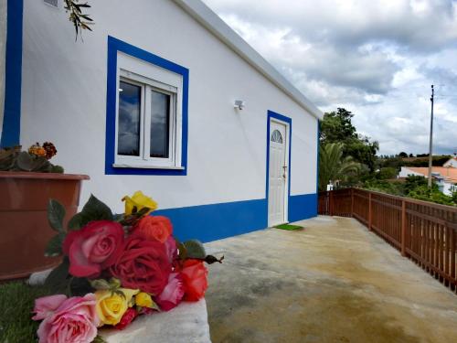 a house with a bouquet of flowers in front of it at Monte da Vinha Nova in Santiago do Cacém