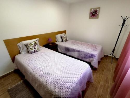 A bed or beds in a room at Monte da Vinha Nova