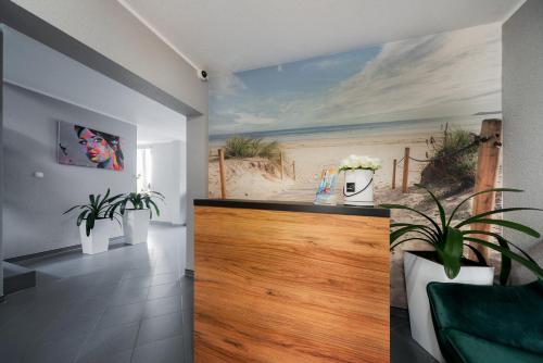 a room with a beach mural on the wall at Villa Bluemica in Międzyzdroje