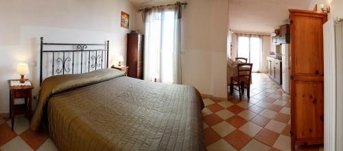 a bedroom with a large bed in a room at il giardino sul mare B&B in Riva Ligure