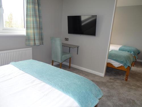 A television and/or entertainment center at Pen Mar Guest House 