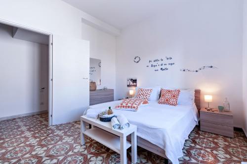 A bed or beds in a room at Baia Verde Beach & Fun Gallipoli - Lecce Selection