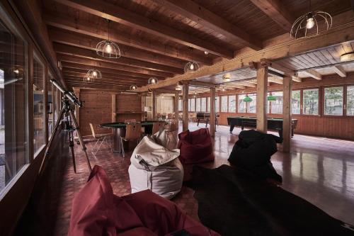 a large room with a camera and a table at Alpine Base Hostel - Adults only in Lauterbrunnen