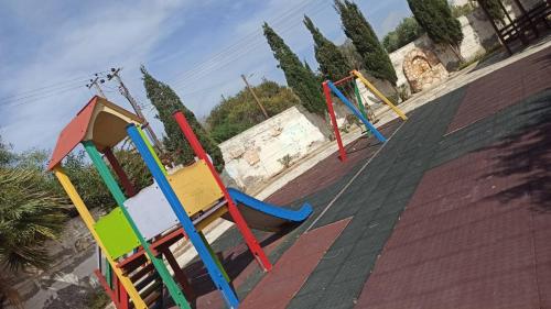 a group of colorful playground equipment on a roof at Olimpus Garden Homes in Ayia Napa