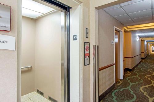 a corridor of a hospital hallway with a door open at Quality Inn & Suites Decatur - Atlanta East in Decatur