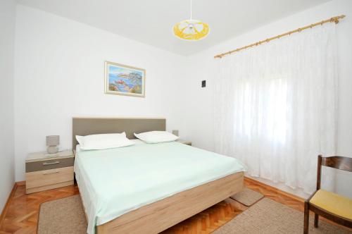 Postel nebo postele na pokoji v ubytování Apartments Break