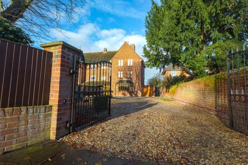 an entrance to a house with a wrought iron fence at Chestnut Grove Bed And Breakfast in Norwich