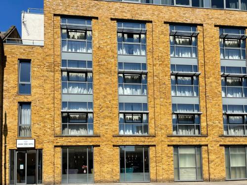 an empty brick building with lots of windows at Axiom Park Hotel in London
