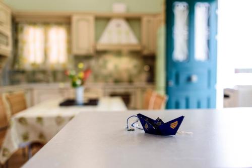 a blue umbrella sitting on top of a table at JASMINE OF POSEIDONIA in Posidhonía