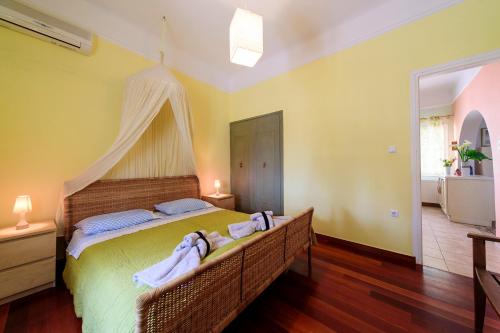 a bedroom with a bed with towels on it at JASMINE OF POSEIDONIA in Posidhonía