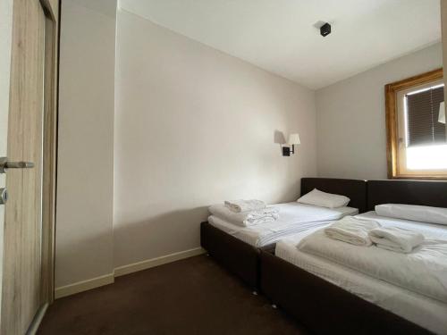 Ένα ή περισσότερα κρεβάτια σε δωμάτιο στο Central Residence by Župa