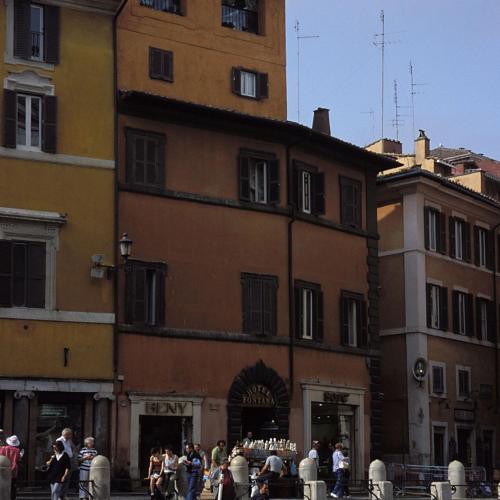 a group of people standing in front of a building at Hotel Fontana in Rome
