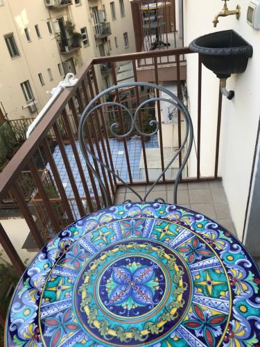 a colorful plate on a table on a balcony at International Naples in Naples