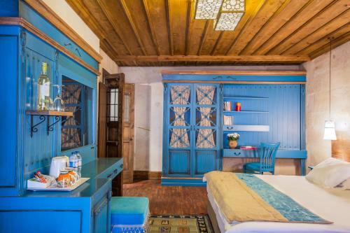 Cama o camas de una habitación en Cappadocia Minia Cave Hotel
