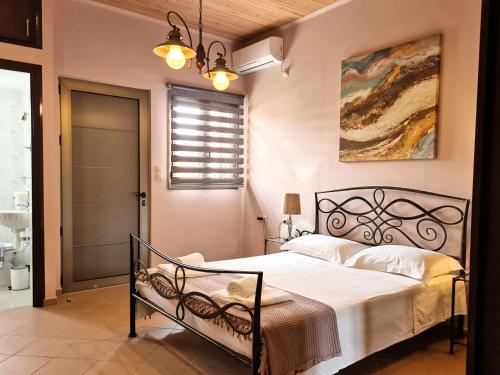 a bedroom with a large bed in a room at On the water lodging 1 in Falasarna