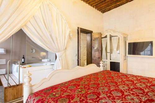Cama o camas de una habitación en Cappadocia Minia Cave Hotel