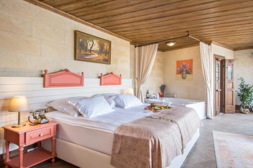 Cama o camas de una habitación en Cappadocia Minia Cave Hotel