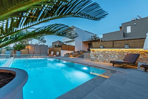 a swimming pool in the middle of a building at Memoria in Gerani
