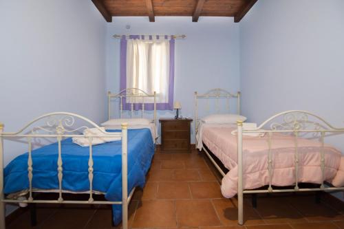Postel nebo postele na pokoji v ubytování Villa Sajonara Elvira
