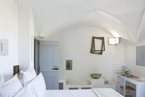 Postel nebo postele na pokoji v ubytování Masseria Cimino