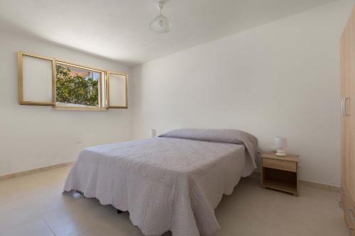 Posteľ alebo postele v izbe v ubytovaní Casetta di Silvia by BarbarHouse